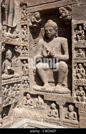 Buddha sculptures carved on the rock. Ajanta caves. Maharashtra. India Stock Photo