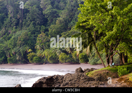 A bench in a remote beach in the peninsula of Osa, Costa Rica Stock Photo