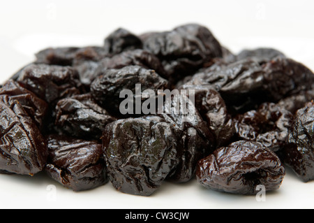 Close up of prunes on white background Stock Photo
