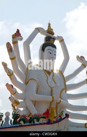 18 arm Buddha statue at Wat Plai Laem temple located on the island of Ko Samui, Thailand. Stock Photo