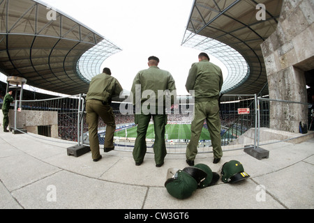 Berlin police exercise control over a football match in Berlin's Olympic Stadium Stock Photo