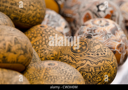 Ecuador, Quito area. Otavalo Handicraft Market. Hand carved dried gourds. Stock Photo