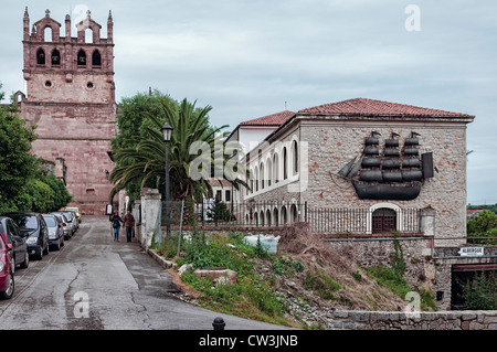 Church of Santa María de los Angeles and the pilgrim hostel in the village of San Vicente de la Barquera, Cantabria, Spain Stock Photo