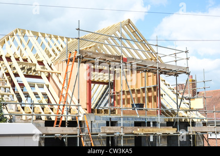 New house under construction with a large dormer roof, Stock Photo