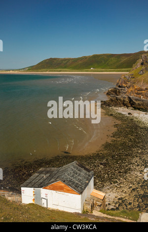 Rhossili beach and downs, overlooking the old boathouse at the Worms Head, Gower, Wales. Stock Photo