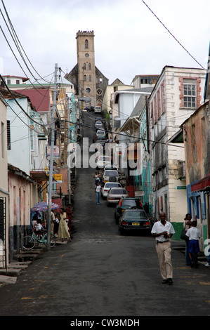 Street scene in St Georges in Grenada, with the Hurricane Ivan-damaged St Andrews Presbyterian kirk at the top of the hill Stock Photo