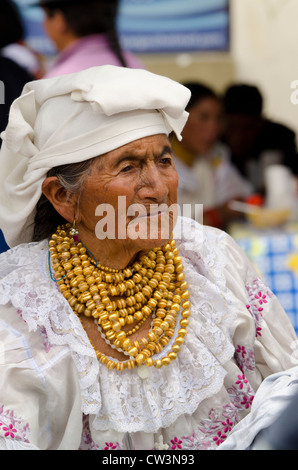 Ecuador, Quito area. Otavalo Market. Indigenous Otavalenos woman in traditional highlands attire. Stock Photo