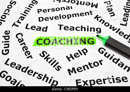 Coaching highlighted with green felt tip pen, with other related words. Stock Photo
