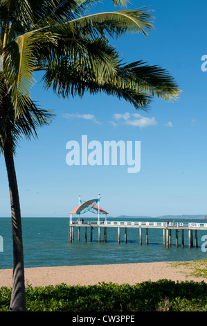 View of Townsville's main beach The Strand with sandy bays, palms, and fishing pier, tropical North Queensland, Australia Stock Photo