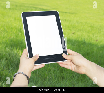 Woman hands holding electronic tablet pc with blank screen. Stock Photo