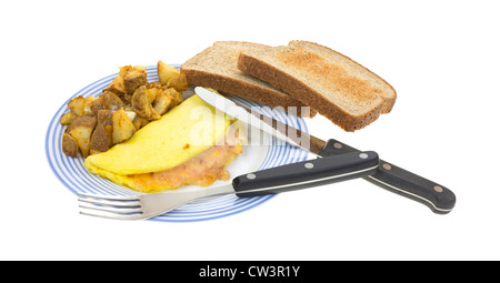Omelet with toast potatoes and silverware Stock Photo
