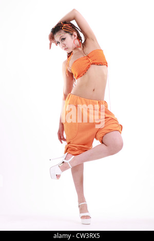 Cute girl in various dance costumes and fun poses. Stock Photo