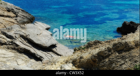 A man snorkeling  in the clear waters of arenal d'en castell menorca spain Stock Photo