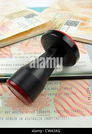 two Australian visas and passport immigration stamps with a black rubber stamp Stock Photo
