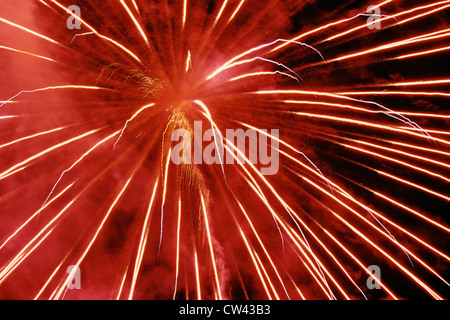 Exploding red fireworks Stock Photo