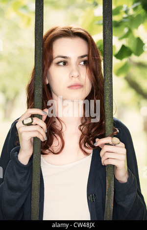 Pensive young woman looking sad Stock Photo