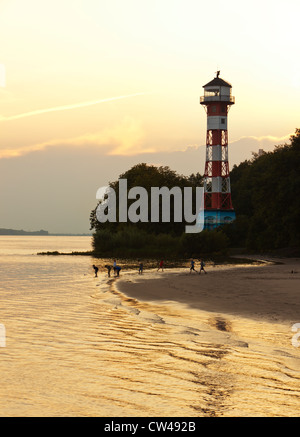 Lighthouse of Wittenbergen on the Elbe river in sunset, westernmost point of Hamburg Stock Photo