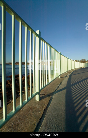 Fence lines the Cliff Walk, Cliffside Mansions of Newport Rhode Island Stock Photo