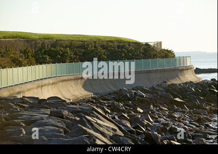 Fence lines the Cliff Walk, Cliffside Mansions of Newport Rhode Island Stock Photo