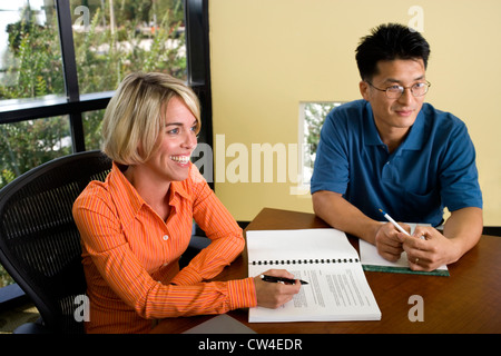 Businessman and a businesswoman in a conference Stock Photo