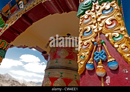Prayer wheel in an open-sided street-side structure at an intersection in downtown Leh, Ladakh, India Stock Photo