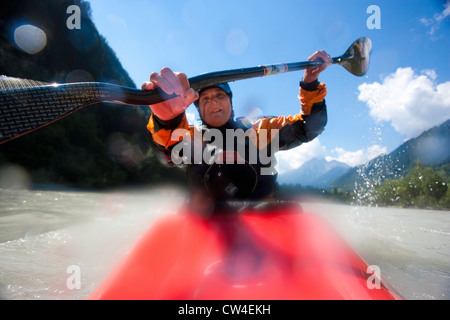 Whitewater kayaker paddling on Inn River near Pfunds, Austria Stock Photo