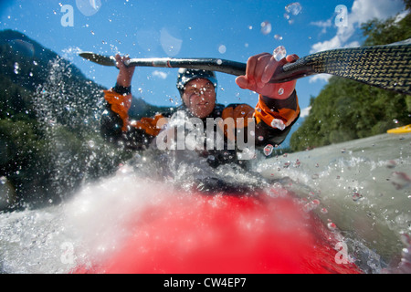 Whitewater kayaker riding rapid on Inn River near Pfunds, Austria Stock Photo