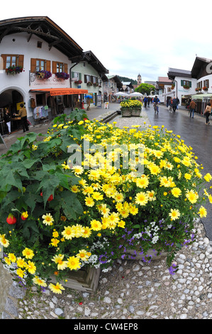 Wet and damp street after a rain shower in Mittenwald, Germany. Stock Photo