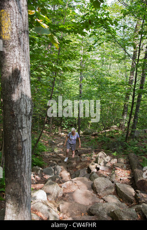 Conway, New Hampshire - Susan Newell, 63, hikes on the Boulder Loop Trail in White Mountain National Forest. Stock Photo