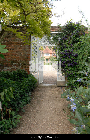 Gate entrance into a walled garden Stock Photo