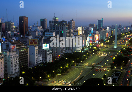 Avenida 9 de Julio, widest avenue in the world, and El Obelisco, The Obelisk at dusk, Buenos Aires, Argentina Stock Photo