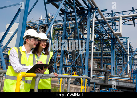 technicians working in industrial chemical plant, norfolk, england Stock Photo
