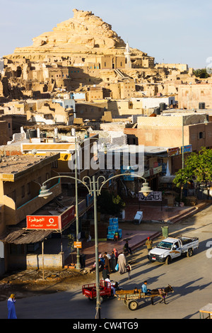 Ruined Shali fortress and square with donkey cart at Siwa oasis. Western desert, Egypt Stock Photo