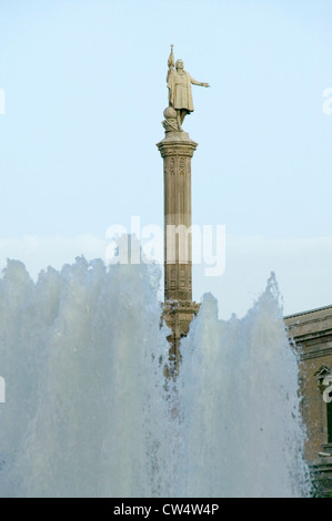 Water fountain and statue of Christopher Columbus at Plaza de Colón in Madrid, Spain Stock Photo