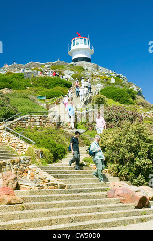 Tourists walking up steps leading to old Cape Point Lighthouse at Cape Point outside of Cape Town, South Africa Stock Photo