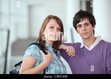 Two students stood in  school corridor Stock Photo