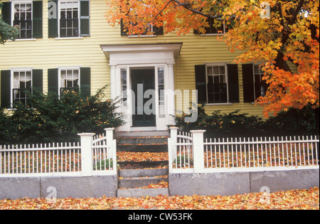 New England home with a white picket fence in autumn, Concord, MA Stock Photo