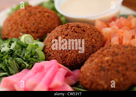 Close-up of Falafel balls with tahini dipping sauce Stock Photo