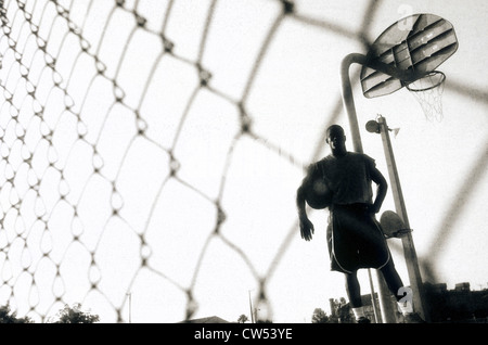 Young man holding a basketball Stock Photo