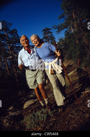 Senior couple hiking in a forest Stock Photo