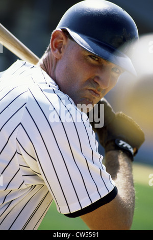 Close-up of a baseball player swinging a baseball bat Stock Photo
