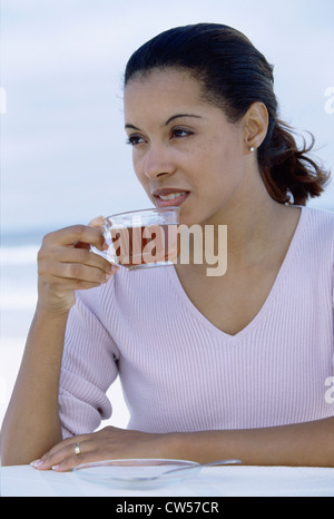 Young woman holding a cup of tea Stock Photo