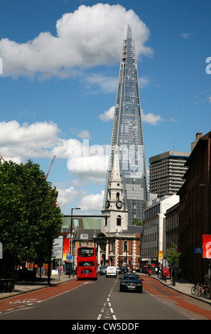 View up Borough High Street past St George The Martyr church to the Shard, London, UK Stock Photo