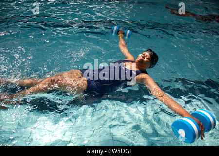 Exercise class at Cally Pool swimming pool, London. People join the class for reasons including weight loss and general fitness. Stock Photo