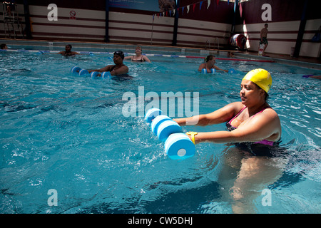 Exercise class at Cally Pool swimming pool, London. People join the class for reasons including weight loss and general fitness. Stock Photo