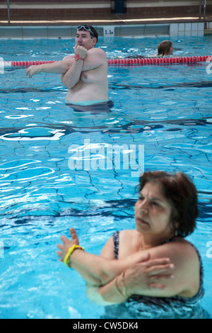 Exercise class at Cally Pool swimming pool, London. People join the class for reasons including weight loss and general fitness. Stock Photo