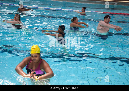 Exercise class at Cally Pool swimming pool, London. People join the class for reasons including weight loss and general fitness. Stock Photo