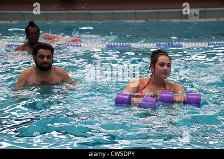 Exercise class at Cally Pool swimming pool, London. People join the class for reasons including weight loss and general fitness. Stock Photo