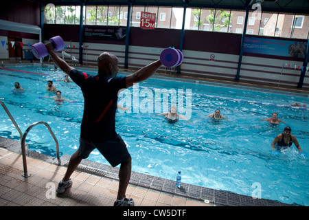 Exercise class at Cally Pool swimming pool, London. People join the class for reasons including weight loss and general fitness. Stock Photo