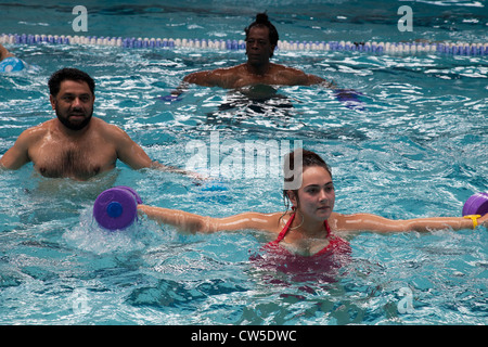 Exercise class at Cally Pool swimming pool, London. People join the class for reasons including weight loss and general fitness. Stock Photo